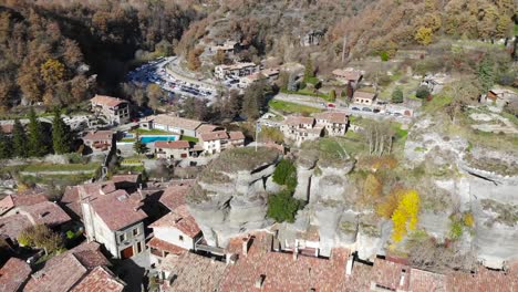 Aerial:-flying-over-a-small-town-in-mountainous-terrain-in-the-catalan-countryside