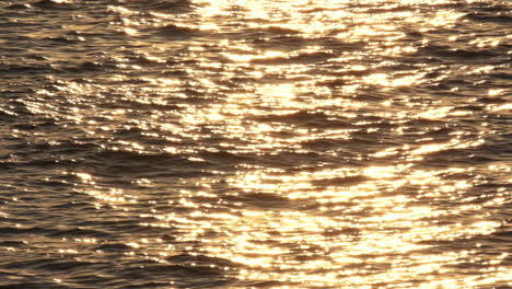 Slow-motion-sea-surface-at-sunset