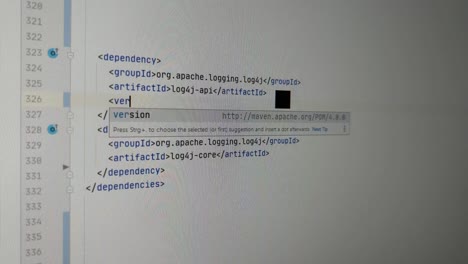Programmer-fixing-zero-day-exploit-Log4J-bug-with-latest-version
