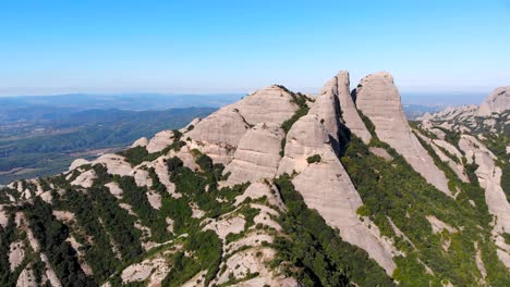 Aerial:-Montserrat-mountain-range-from-the-air-in-a-sunny-day