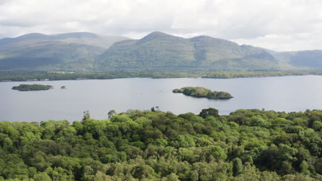 AERIAL---Mountains-in-Killarney-National-Park-and-Muckross-Lake,-Ireland,-reverse