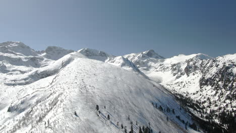Drone-shot-of-snowy-peak-and-ski-slope-in-Malyovitsa-in-Bulgaria