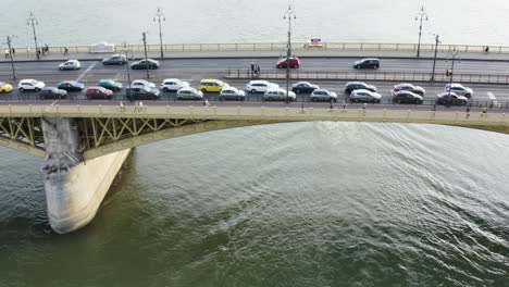 AERIAL---Margaret-Bridge-on-the-Danube-River,-Budapest,-Hungary,-truck-left