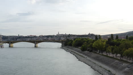 AERIAL---Margaret-Bridge-and-Island,-Danube-River,-Budapest,-Hungary,-truck-left
