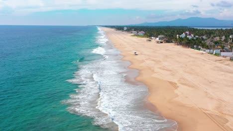 Pie-de-la-Cuesta-beach-emerald-sea-and-pristine-sand-beach,-Acapulco-Guerrero
