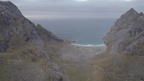Aerial-view-of-the-Bunes-beach,-in-middle-of-mountains-in-Lofotodden-Nasjonalpark,-Norway---circling,-drone-shot