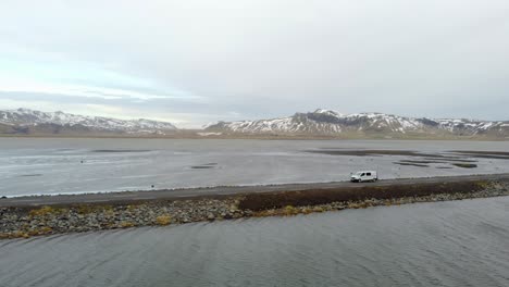 Car-driving-on-beautiful-road,-travel-background,-aerial-scenic-landscape-from-Iceland