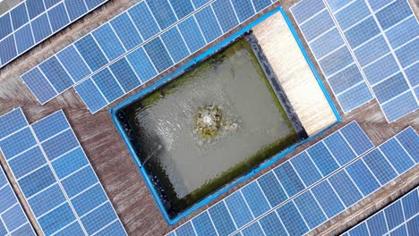 Water-Fountain-Surrounded-With-Solar-Panels-At-Daytime