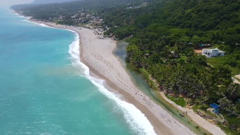 The-shortest-river-in-the-Caribbean,-Los-Patos,-Barahona-aerial-view-of-the-river-next-to-the-beach,-stunning-aerial-view-in-a-sunny-day