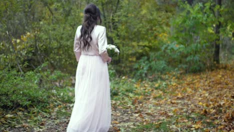 Bride-walking-in-the-forest