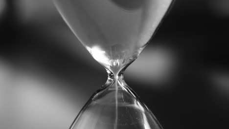 Hourglass-with-white-sand-pouring-inside,-eternal-time,-infinity,-business-time