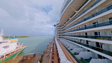 Drone-Flying-Close-Around-A-Luxury-Cruise-Ship-Anchored-At-Taino-Bay-Cruise-Terminal-In-Puerto-Plata,-Dominican-Republic