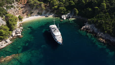 Luxury-Passenger-Ship-Anchored-At-Beach-Cove-In-Peljesac,-Croatia