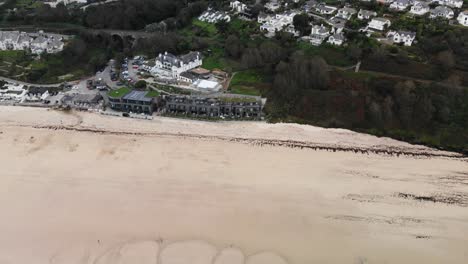 Aerial-forward-shot-of-Carbis-Bay-beach-and-Hotel-in-Cornwall-England-UK