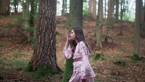 European-Girl-In-Floral-Dress-Walking-In-The-Mountain-Forest