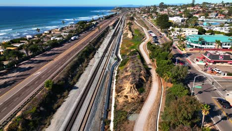 Slow-motion-shot-over-Coast-Highway-101-and-the-train-tracks-along-the-Cardiff-by-the-Sea-coast-in-Encinitas,-California