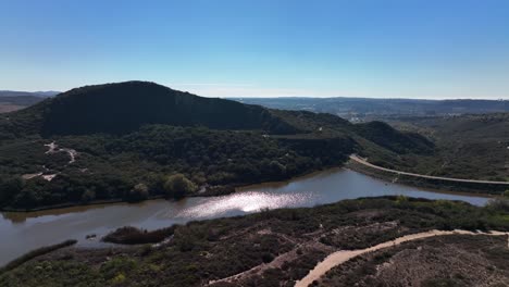 Slow-motion-aerial-drone-shot-of-Calavera-Hills-on-a-summer-day-with-lake-in-view