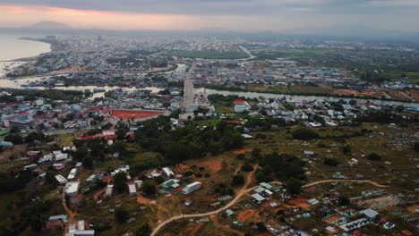 An-aerial-view-of-Phan-Thiet-city-based-on-the-ocean-coast-and-situated-in-Binh-Thuan-province,-South-Vietnam