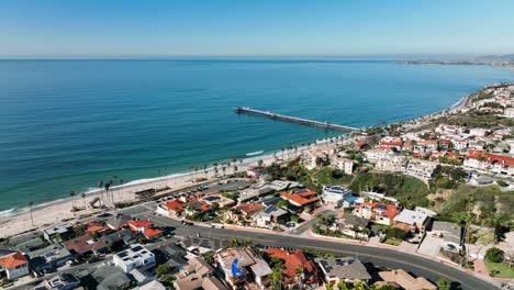 Aerial-drone-view-of-San-Clemente-Pier-with-beach-and-coastline-before-sunset-time