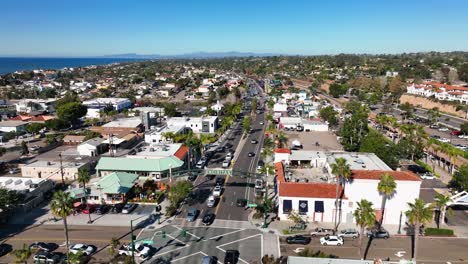 Aerial-view-of-Encinitas-intersection-with-moving-cars-and-buildings-on-the-side