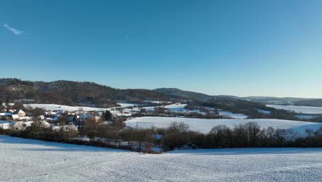 Winter-wonderland-snowy-fields---forward-moving-drone-shot