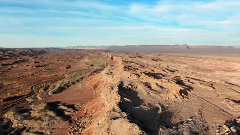 Aerial-View-Of-Rugged-Rock-Formations-In-Arid-Eroded-Canyon-Landscape