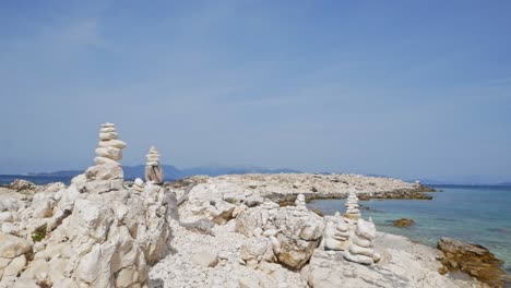 Beach-Stone-Stacks-At-Alexia-Beach-In-Greece---wide-shot