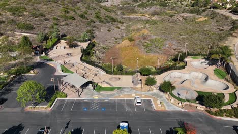 Aerial-view-of-outdoor-concrete-skate-park-with-ramps-Alga-Norte-Park,-Carlsbad-in-California,-USA