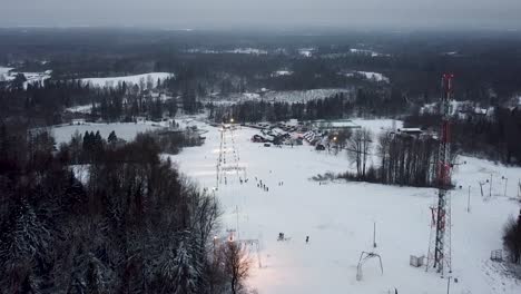 High-aerial-drone-view-of-Kuutsemäe-snow-sports-centre-in-Southern-Estonia-in-winter