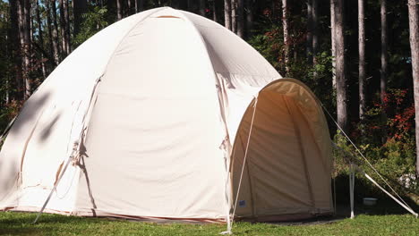 A-white-tent-is-equipped-in-a-forest