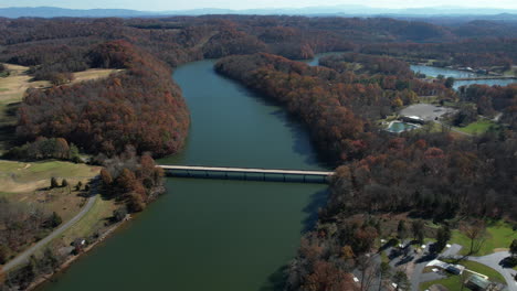 Aerial-View-of-Bridge-Above-Lake-and-Campground-at-Warriors-Path-State-Park,-Tennessee-USA,-Drone-Shot
