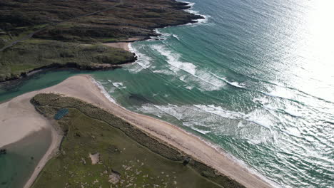 Aerial-View-of-Picturesque-Coastline-of-Ireland,-Ocean-Waves-Breaking-on-Sandy-Beach-at-Barley-Cove,-County-Cork,-Drone-Shot