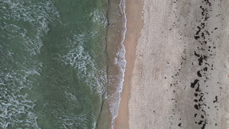 Top-Down-Aerial-View-of-Atlantic-Ocean-Waves-Breaking-on-Sandy-Beach-on-Irish-Coastline,-Barleycove,-County-Cork-Ireland