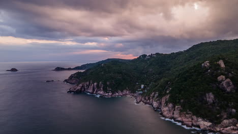 Aerial-shot-over-the-scenic-mountain-cliffs-leading-to-the-Adriatic-sea-belowfrom-morning-to-evening-on-an-overcast-day-in-Montenegro-in-timelapse