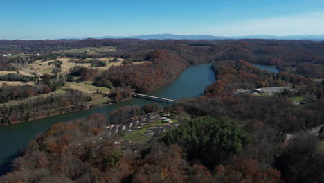 Aerial-View-of-Warriors-Path-State-Park,-Tennessee-USA,-Bridge-Above-Lake-and-Landscape-in-Autumn-Season,-Drone-Shot