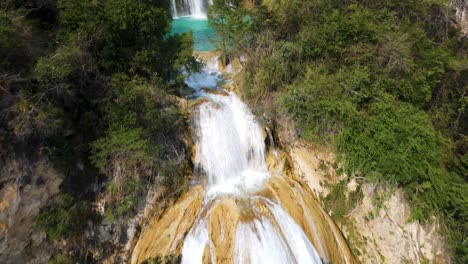 4K-aerial-view-over-waterfall-cascade-in-tropical-Mexico-rainforest-canyon