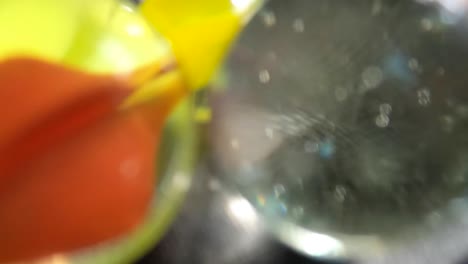A-slow-motion-macro-view-of-a-marble-as-it-crashes-through-other-marbles