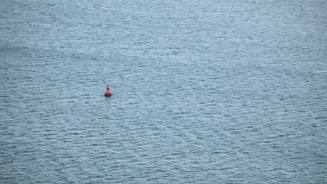 Distant-View-Of-Buoy-Floating-In-The-Middle-Of-The-Sea
