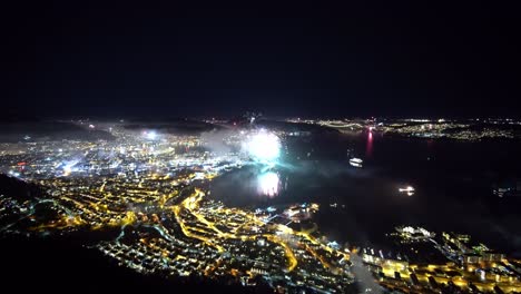 Spectacular-new-years-eve-timelapse-in-Bergen-Norway-seen-from-mountain-Stoltzen---Enormous-amounts-of-fireworks-at-midnight