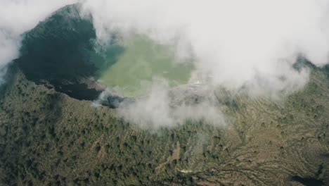 El-Chichonal-Volcano-with-green-sulfuric-lake-in-crater-in-Chiapas,-Mexico---aerial-drone-shot