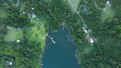 Close-up-of-a-hidden-dock-in-the-middle-of-the-forest---aerial