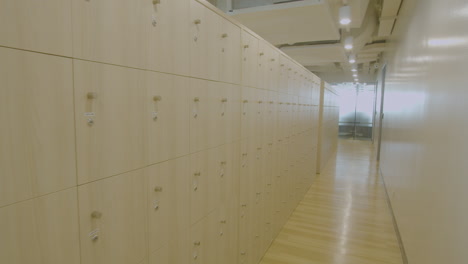 Dolly-In-Shot-In-A-New-and-Modern-Office-Locker-Area-In-Daytime