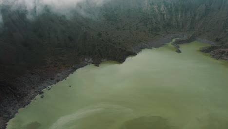 Vapor-Gas-Vents-And-Green-Lake-In-Volcanic-Crater-El-Chichonal-in-Chiapas,-Mexico---aerial-drone-shot