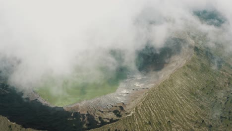 Misty-Landscape-At-El-Chichonal-Volcano-With-Green-Sulfuric-Lake-In-Crater---aerial-drone-shot