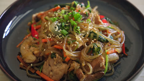 japchae-or-stir-fried-Korean-vermicelli-noodles-with-vegetables-and-pork-topped-with-white-sesame---Korean-traditional-food-style