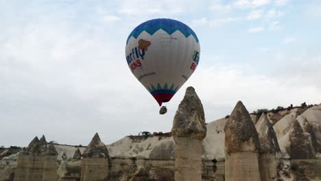 Hot-Air-Balloon-In-Scenic-Landscape-Of-Cappadocia-In-Turkey---aerial-drone-shot