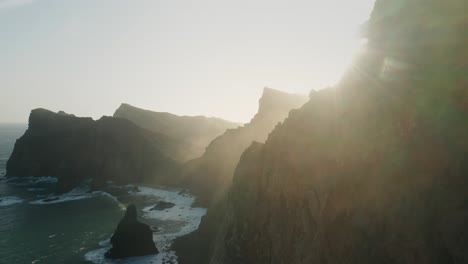 Steep-mountain-cliffs-on-edge-of-Atlantic-Ocean-of-Madeira,-bright-morning-sunlight,-Ponta-de-São-Lourenço
