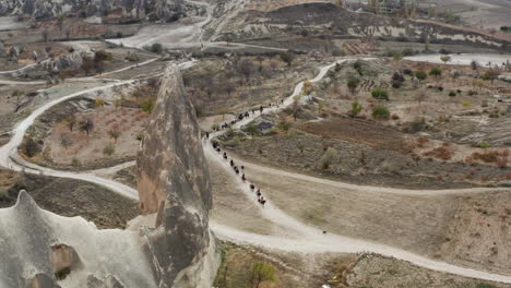 Horseback-Riding-Tours-In-Cappadocia,-Turkey.---aerial