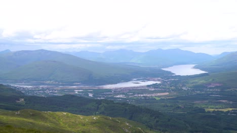 Beautiful-timelapse-over-the-outstrechted-green-nature-of-the-Scottish-highlands-looking-down-on-Fort-William-on-a-partly-cloudy-day