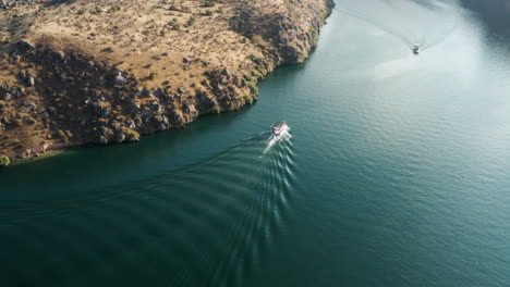 Aerial-View-Of-Ferry-Boat-Sailing-In-The-Euphrates-River-In-Halfeti,-Sanliurfa,-Turkey